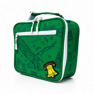 A green zippered lunch bag with a white zipper, featuring a dark green eagle graphic and a yellow Liberty Bell patch on the front, set against a plain white background.