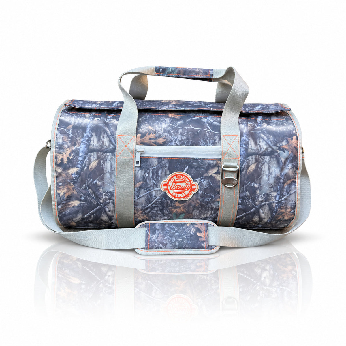 Varsity Cooler Backwoods camo duffel cooler, front view with carry handles and shoulder strap